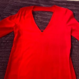 Red moda international dress. Deep v front and cut out in back